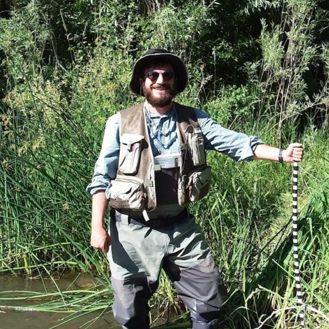 Stephen Huysman doing a survey of riparian vegetation.